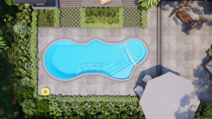 Aerial view of a backyard with a curvy swimming pool, surrounding patio, two lounge chairs under an umbrella, and greenery along the fence.
