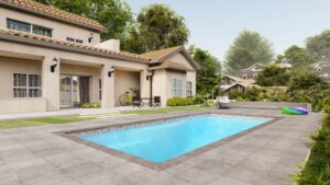 Wylela model pool with clear water, surrounded by landscaped patio, outdoor seating, and greenery, showcasing Eco Landscaping Design's outdoor transformation services.