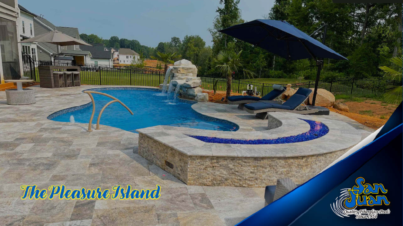 A backyard with a small pool featuring a waterfall, stone decking, lounge chairs with an umbrella, and landscaped surroundings. "The Pleasure Island" and "San Juan Pools" logos are visible.